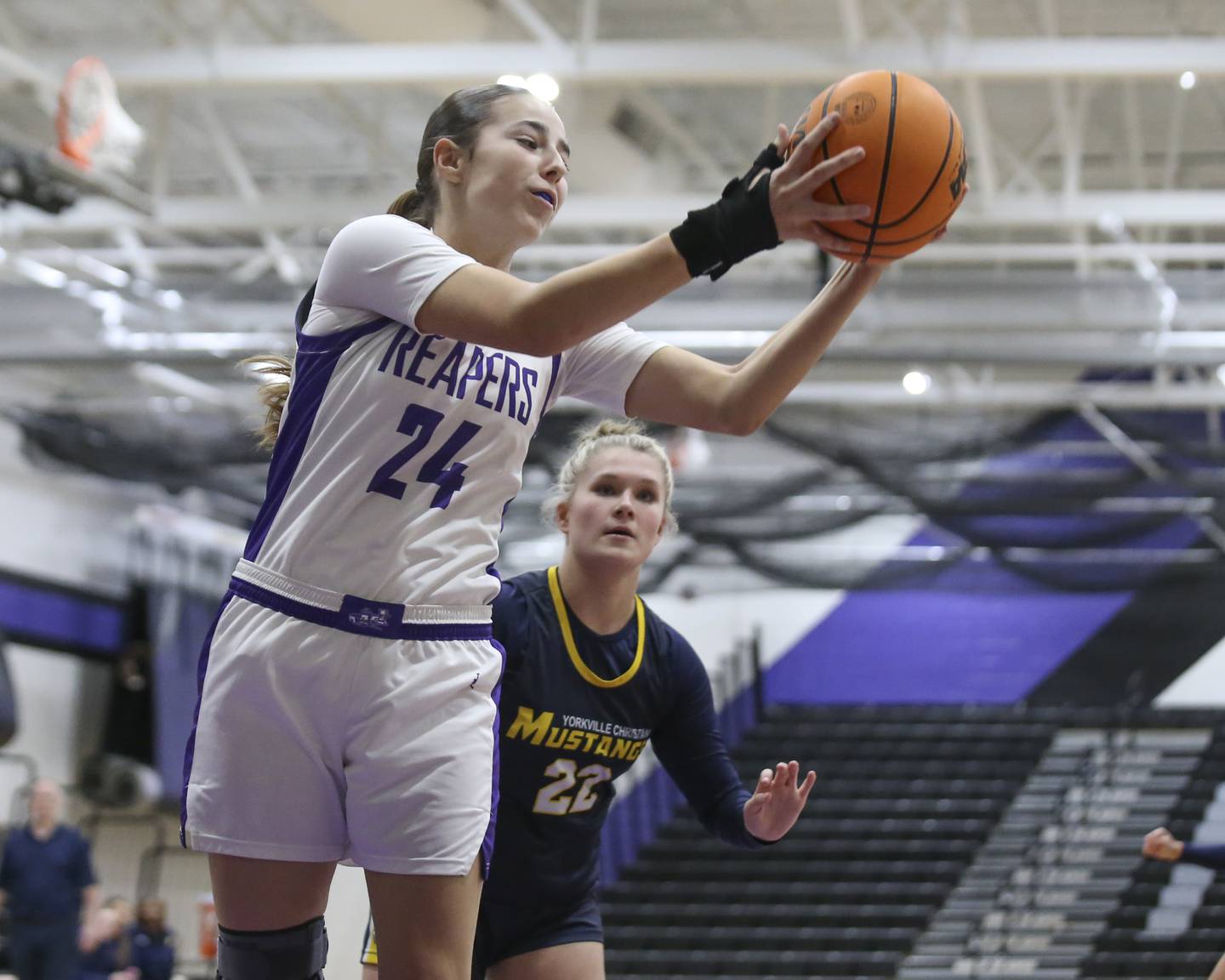 Plano's Chloe Rowe (24) grabs a rebound during their basketball game between Yorkville Christian at Plano Wednesday, Jan 07, 2026 in Plano.