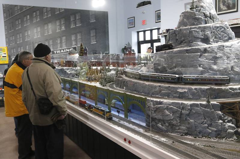 People look as a model train on Saturday, Jan. 21, 2023, as the Illinois Railway Museum celebrates its 70 anniversary with the first of many celebrations by commemorating the 60 years since the abandonment of the Chicago North Shore and Milwaukee Railroad.