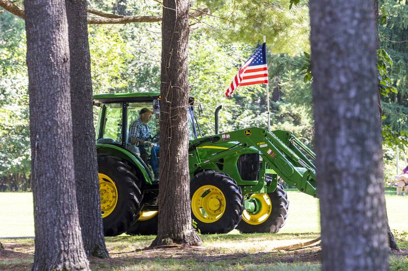 Ivan Shank of Sterling leads the tractor parade Saturday, Aug. 31, 2024, through Lowell Park.