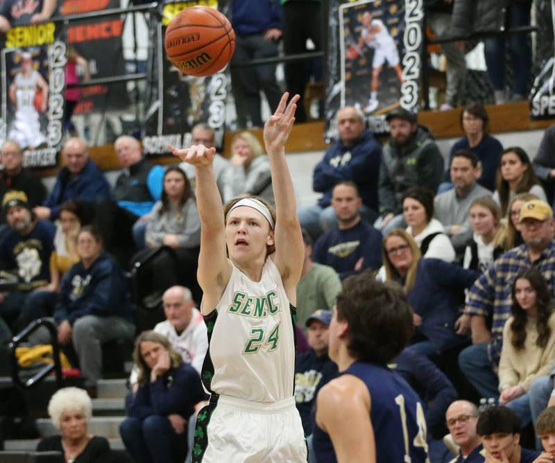 Seneca's Given Siegel shoots a jump shot over Marquette's Alex Graham during the Tri-County Conference championship game on Friday, Jan. 27, 2023 at Putnam County High School.