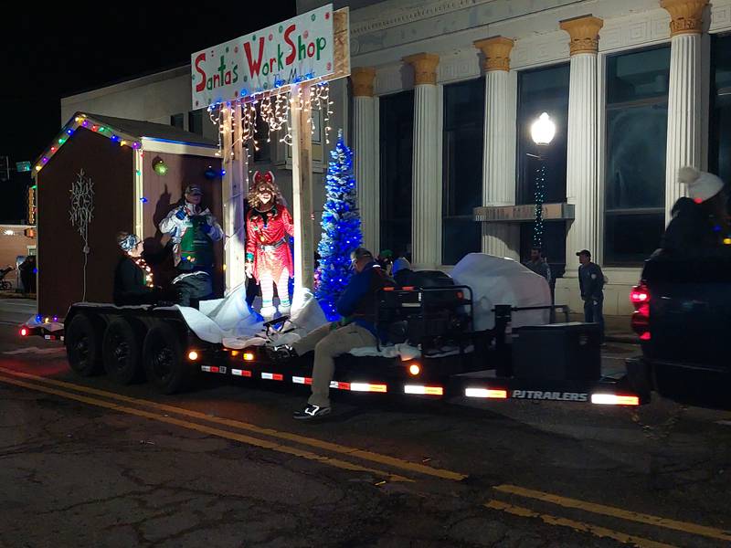 A float makes its way along the Lighted Christmas Parade route Saturday, Dec. 2, 2023, in downtown Peru.