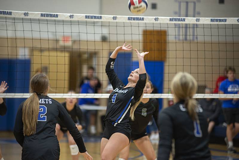 Newman’s Katie Grennan sets the ball Tuesday, Sept. 27, 2022 against St. Bede.