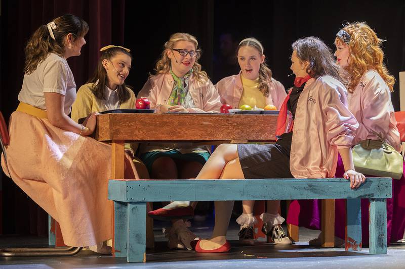 Cast members rehearse a scene for Dixon High School’s rendition of Grease Wednesday, March 12, 2025. The classic musical is based around a summer love that unexpectedly follows the two back to a 1950’s high school.