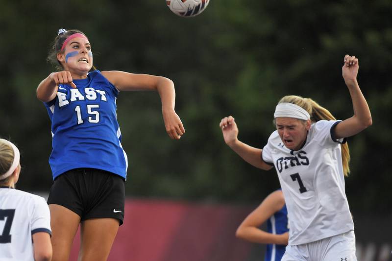 Lincoln-Way East’s Ellie Feigl and O’Fallon’s Addison Baldus compete for a header in the IHSA girls Class 3A state soccer semifinal game at North Central College in Naperville on Friday, June 2, 2023.