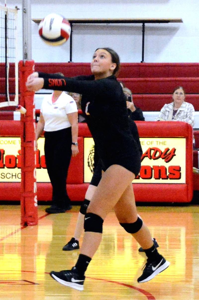 LaMoille senior Grace Kelly makes a pass at the net Tuesday night at Dean Madsen Gymnasium. The Lions scored a senior night victory for their first win of the season.