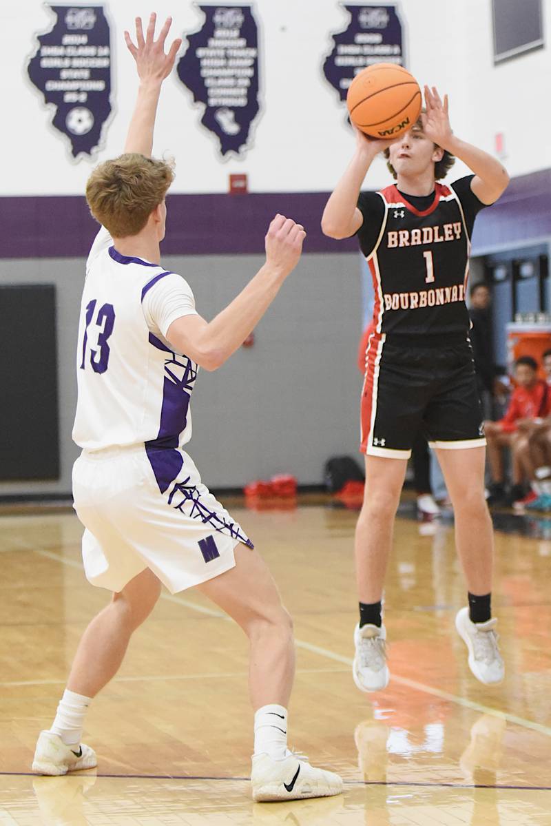 Bradley-Bourbonnais' Drew Kubal, right, shoots a 3-pointer contested by Manteno's Ramsey Owens during a game at Manteno Saturday, Dec. 6, 2025.