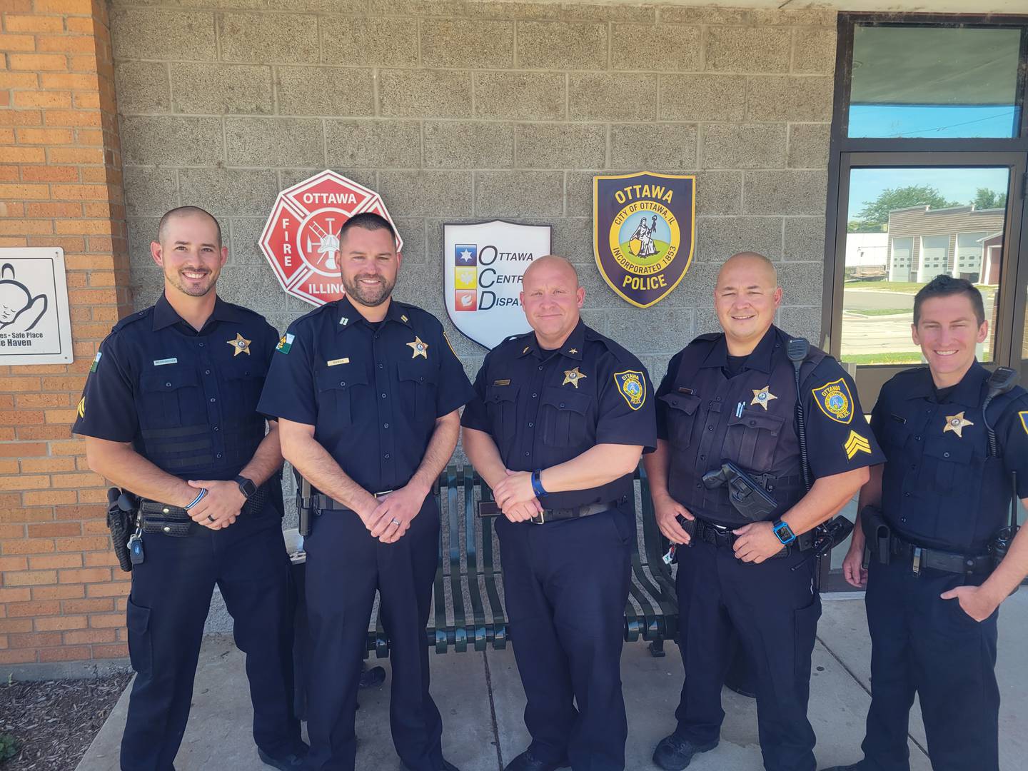 Ottawa Police Chief Brent Roalson (center) stands with Cpl. Najdanovich, Sgt. Jason Bell, Cpl. Jobst and Capt. Booras after their recent promotions.