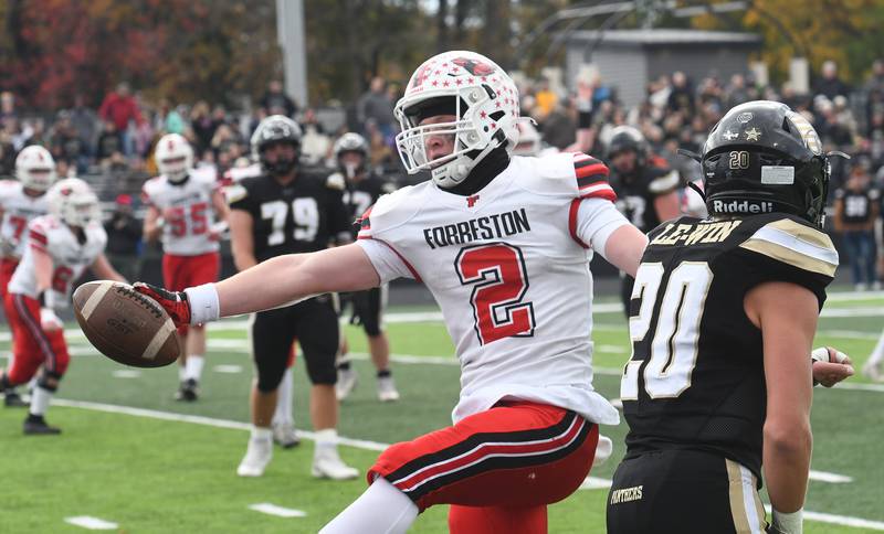 Forreston's Connor Politsch holds the ball over the goal line for a two-point conversion in first half action against Lena-Winslow in 1A playoff action in Lena on Saturday, Nov. 1, 2025.