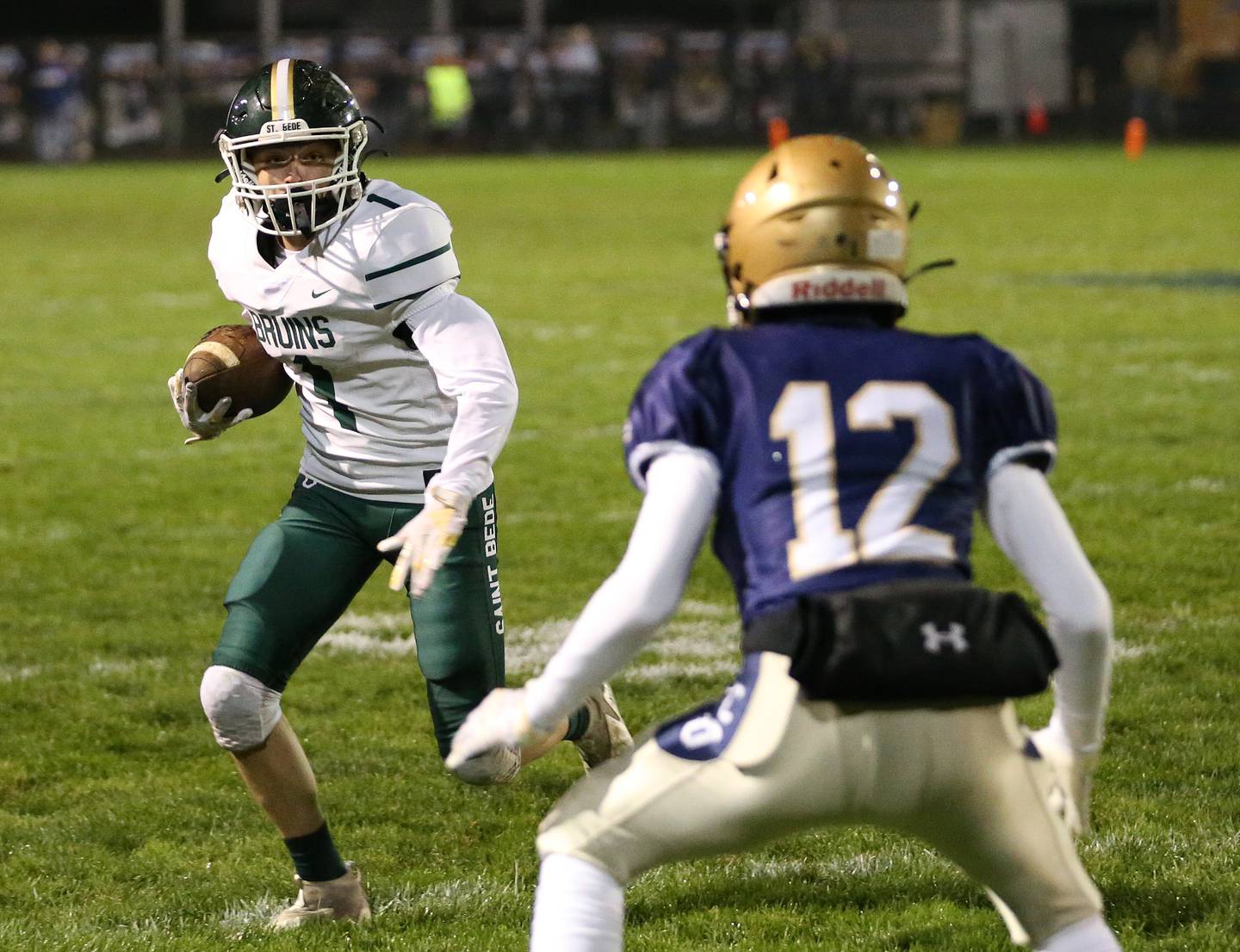 St. Bede's Alex Ankiewicz runs the ball as Marquette's Rush Keefer defends on Friday, Oct. 13, 2023 at Gould Stadium.