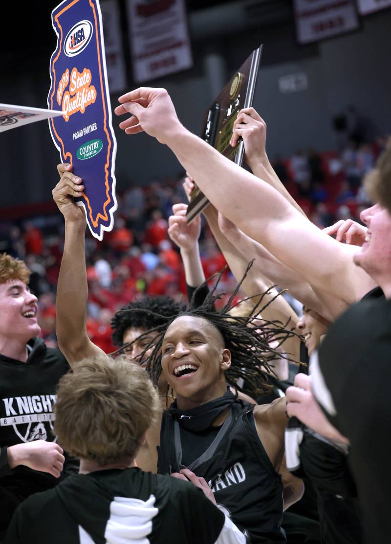 Kaneland players celebrate their win over Morton Monday, March 9, 2026, after their IHSA Class 3A supersectional matchup in the Convocation Center at Northern Illinois University in DeKalb.