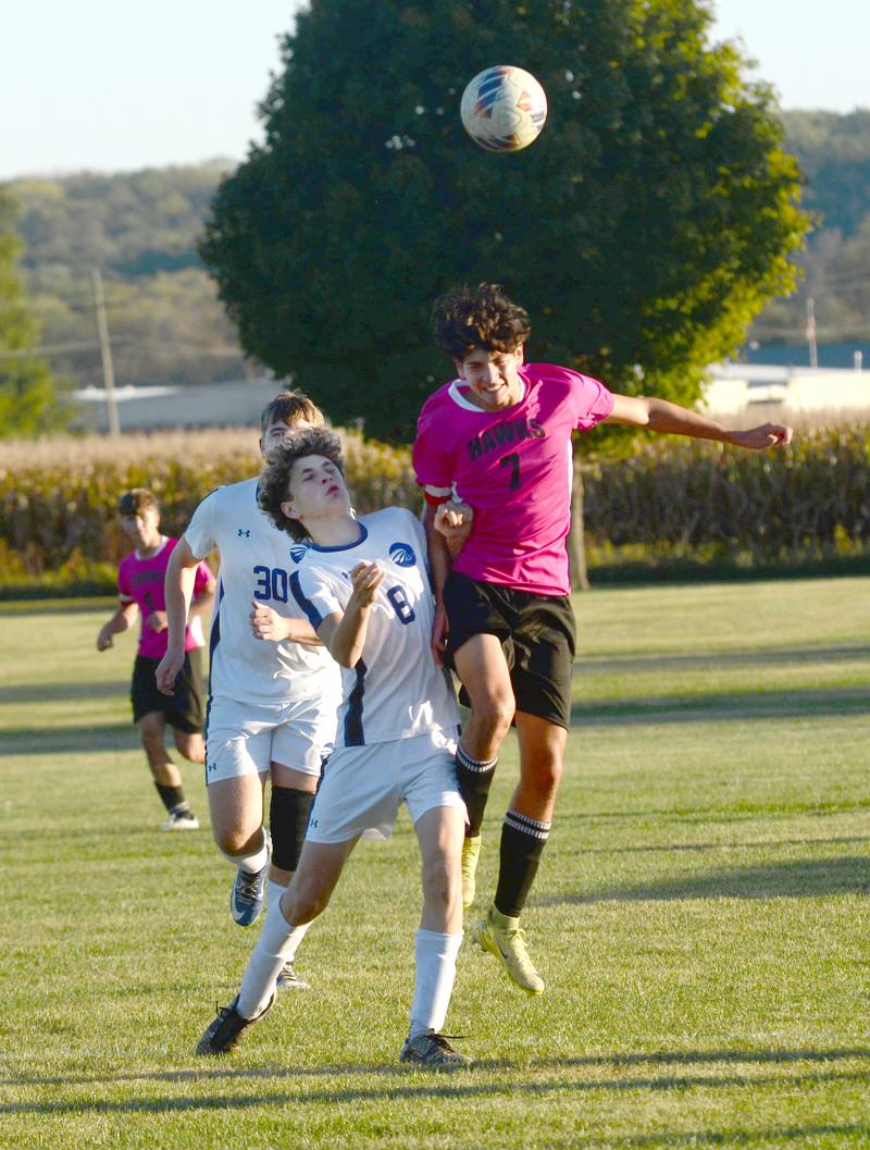 Oregon's Aiden Hammer (7) and Faith Christian's Jaxen Coester (8) battle for the ball during a Thursday, Oct. 9, 2025 game at Oregon Park West.