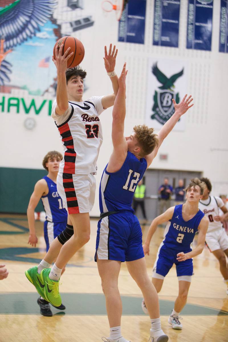 Benet's Nikola Abusara puts the layup up over Geneva's Thomas Diamond at the Class 4A Sectional Final at Bartlett on Friday, March 3, 2023.