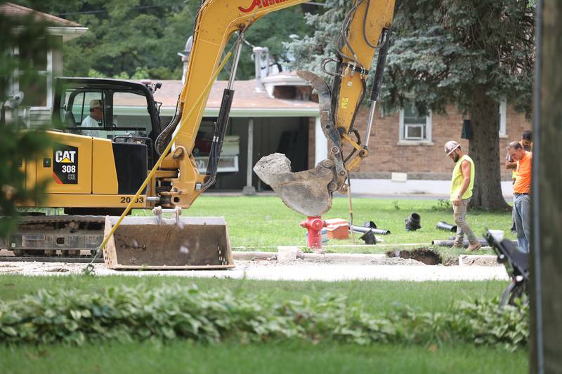 Construction workers dig up along Oakview Avenue to lay down water pipes in Joliet. Thursday, August 4, 2022 in Joliet.