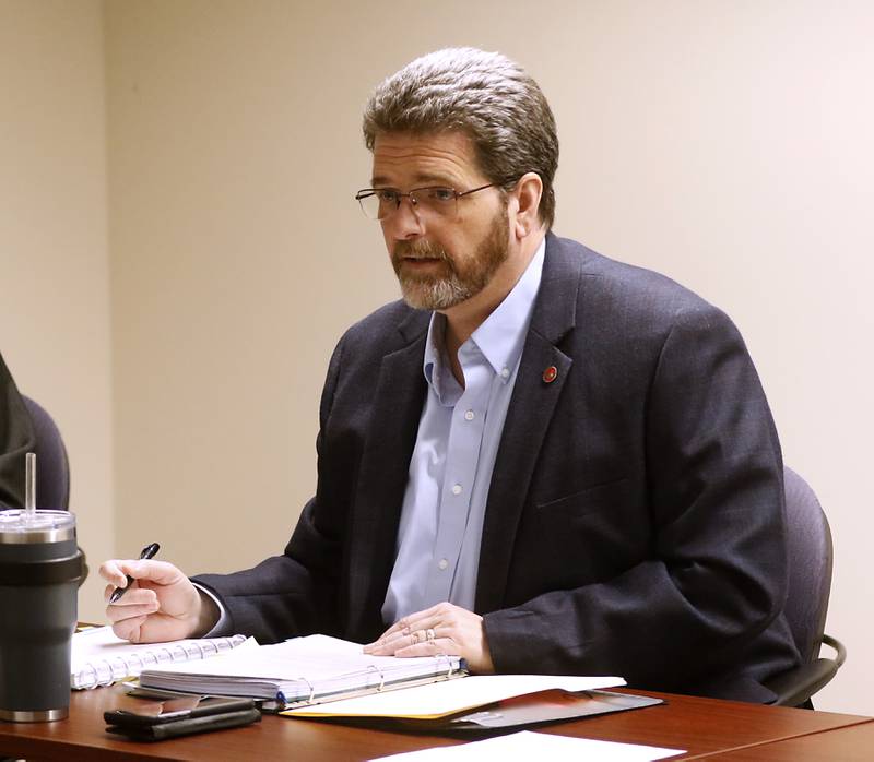 McHenry County Clerk Joe Tirio listens to attorneys speak during a hearing of McHenry County Electoral Board on Monday, March 28, 2022, at the McHenry County Administration Building in Woodstock. The hearing is the result of an objection filed the week prior by William Brogan and Joel Brumlik disputing Tony Colatorti's qualifications to run for the position of McHenry County sheriff.