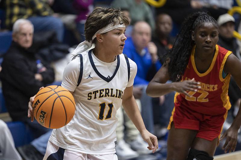 Sterling’s Joslynn James handles the ball against Rock Island Tuesday, Nov. 25, 2025.