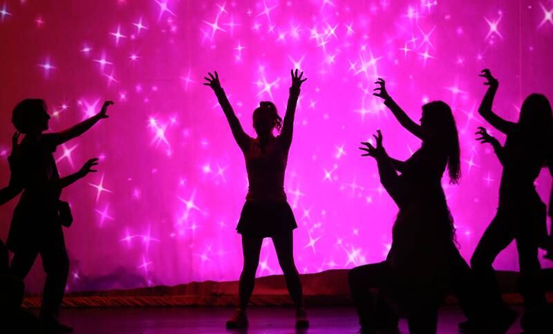 Members of the cast of "Mean Girls-High School Version act out a scene out a scene during a rehearsal on Monday, March 10, 2025 in Matthiessen Auditorium at La Salle-Peru Township High School.