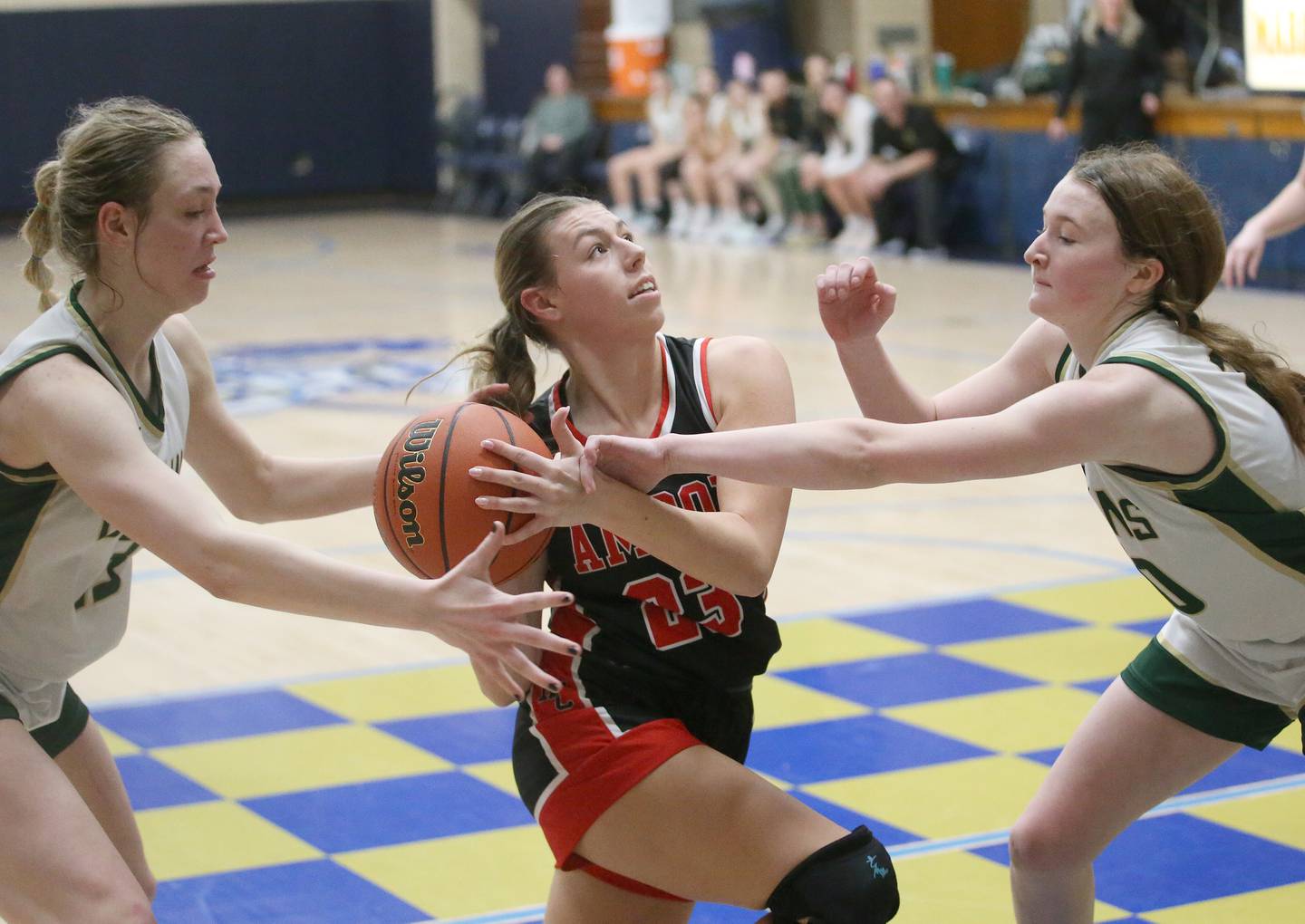 Amboy's Maeve Larson looses control of the ball as St. Bede's Ashlyn Ehm and Ella Englehaupt defend during the Class 1A Regional final game on Friday, Feb. 16, 2024 at Marquette High School.