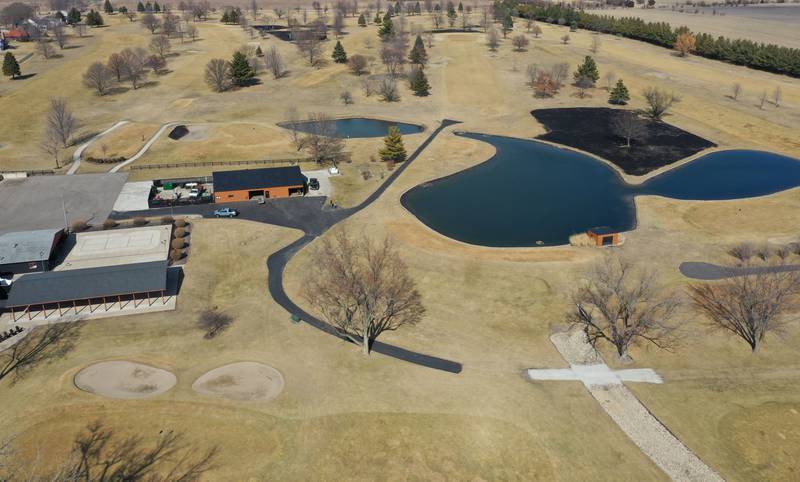 Crews burn off part of the green area for a controlled burn on Monday, March 2, 2026 at Deer Park Golf Club in Oglesby.