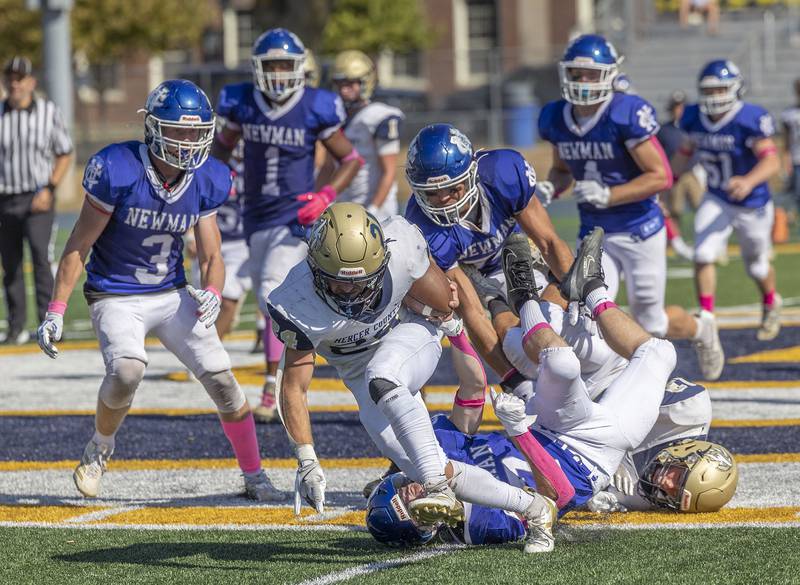 Mercer County’s Tannen James Whitehall stays on his feet for yards against Newman Saturday, October 4, 2025.
