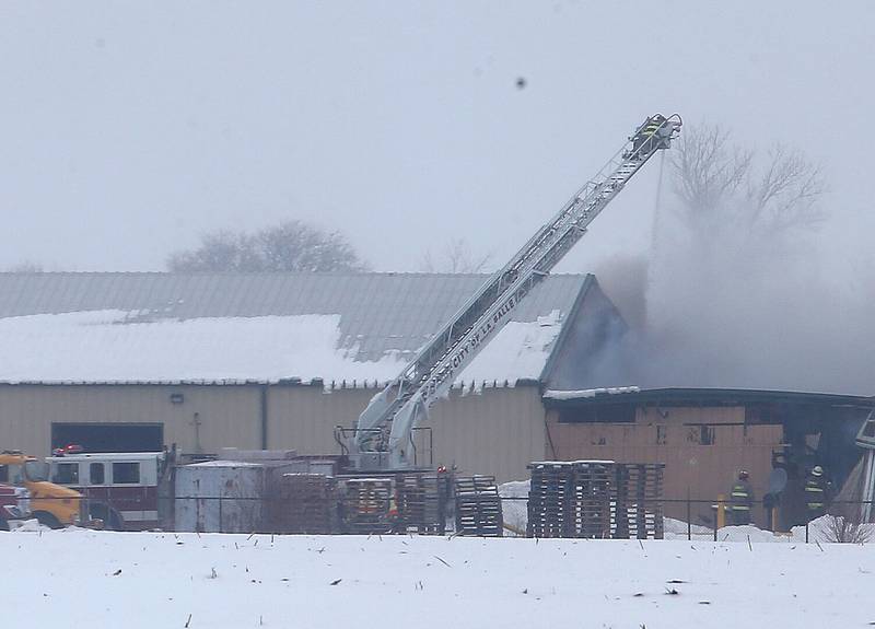 La Salle firefighters use their ladder truck to spray water on a fire at LSC Environmental Products on Monday, Jan. 22, 2024 near Lostant. The company was the former Phoenix Paper Products. It is located between Tonica and Lostant off of Illinois 251.