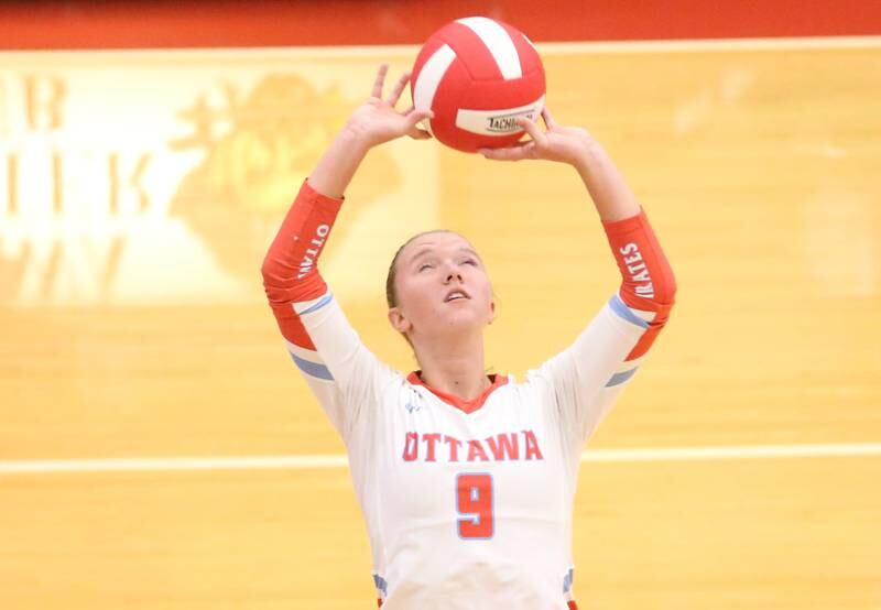 Ottawa's Skylar Dorsey sets the ball in the air against L-P on Thursday, Oct. 17, 2024 in Kingman Gym at Ottawa High School.