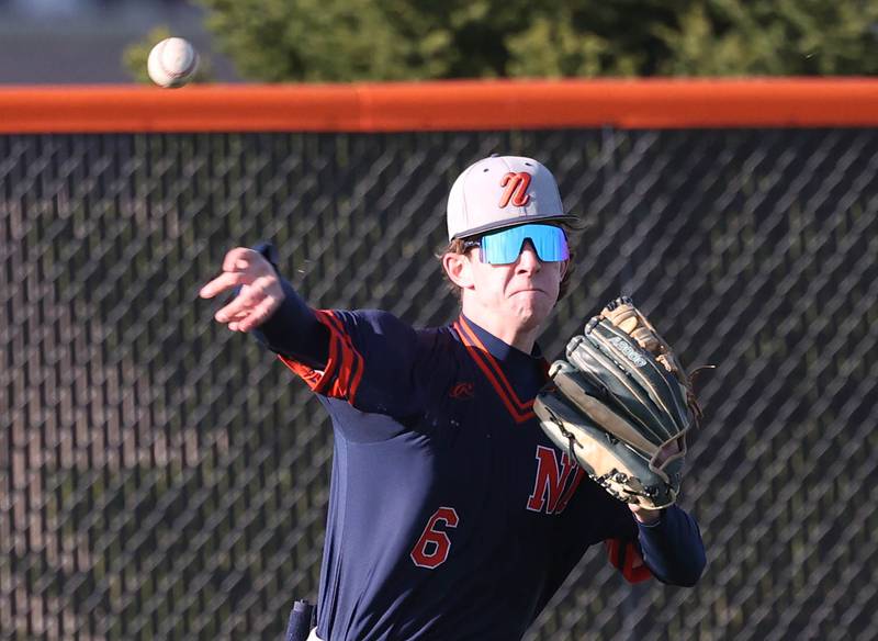 Naperville North's Matt Cantrell gets the ball back into the infield Tuesday, April 15, 2025, during their game at DeKalb High School.