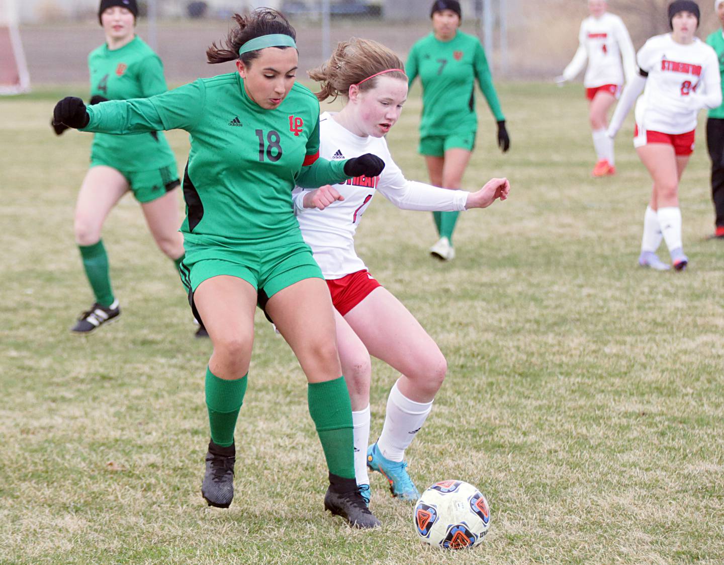 L-P's Analiyah Flores (18) and Streator's Bridget McGurk (14) compete for the ball during the teams' 2022 meeting.