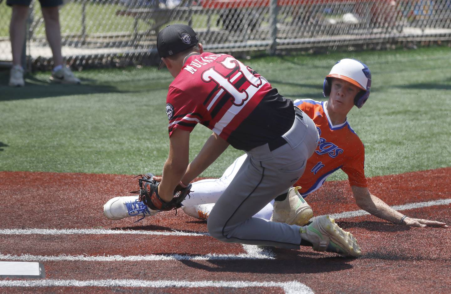 Barrington Broncos Red’s Dane Mularski  tags out the Windy City Hit Dog’s —Offdenkamp’s Colton Snare during a semi-final baseball game against The Barrington Broncos Red in a Under 13 McHenry County Youth Sports Association’s Summer International Championship baseball tournament on Monday, July 14, 2025, at the Mickey Sund Baseball Complex in Crystal Lake's Lippold Park.