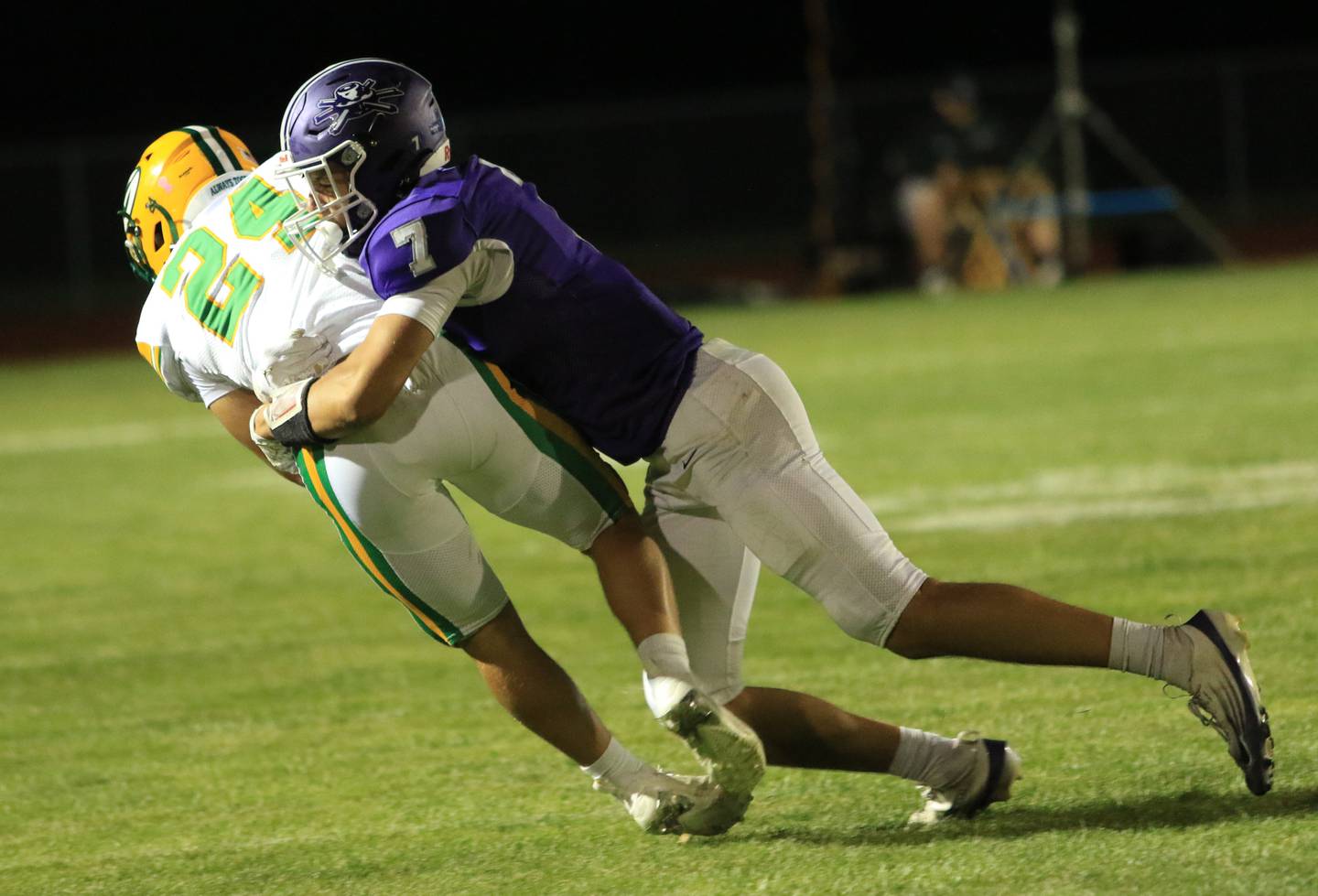 Rochelle's Mark Green (7) makes a tackler of a Geneseo runner during their game Friday, Aug. 29 in Rochelle.