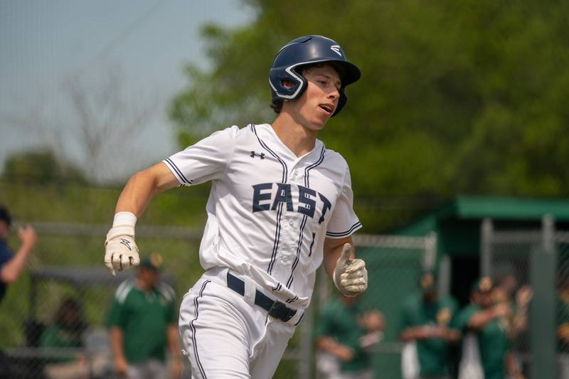 Oswego East's Michael Polubinski (1) rounds first base after driving in a run against Waubonsie Valley during the Class 4A Waubonsie Valley Regional final between Waubonsie Valley and Oswego Easy at Waubonsie Valley High School in Aurora on Saturday, May 27, 2023.