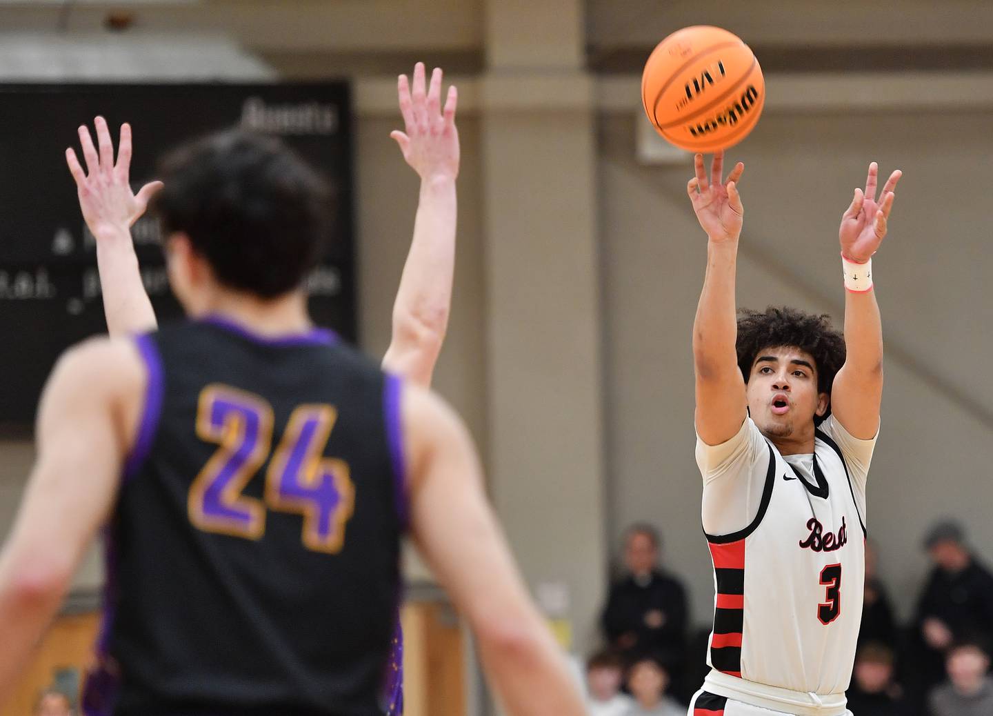 Benet’s Jayden Wright (3) shoots a three pointer during the Class 4A Benet Sectional championship game against Downers Grove North on March 7, 2025 at Benet Academy in Lisle.