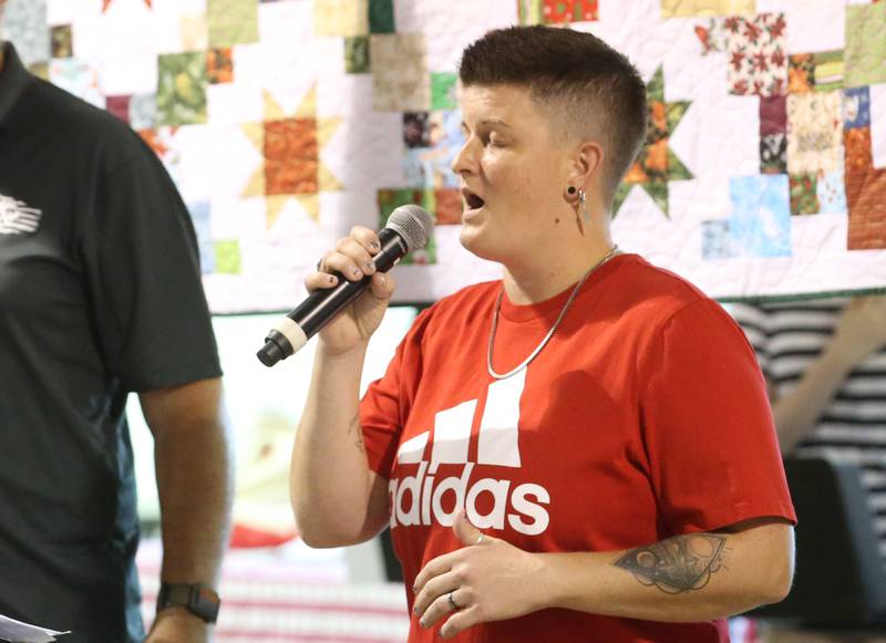 Kira Thompson sings "The National Anthem" during the Tribute to Veterans on Wednesday, Aug. 20, 2025 at the Bureau County Fair in Princeton.