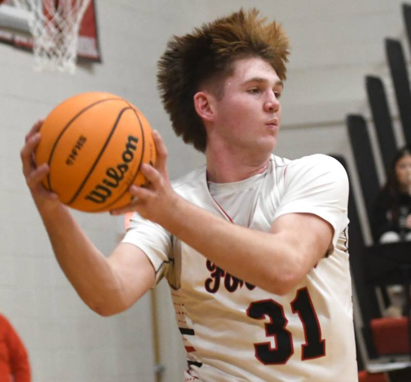 Forreston's Brennan Byers grabs a rebound against AFC on Saturday, Jan. 17, 2026 at Forreston High School.