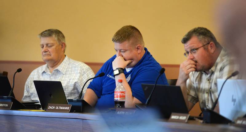 Ogle County Board members Don Griffin, Zach Oltmanns, and Austin Gillis listen during the public comment period at the Tuesday, July 15, 2025, county board meeting in Oregon.