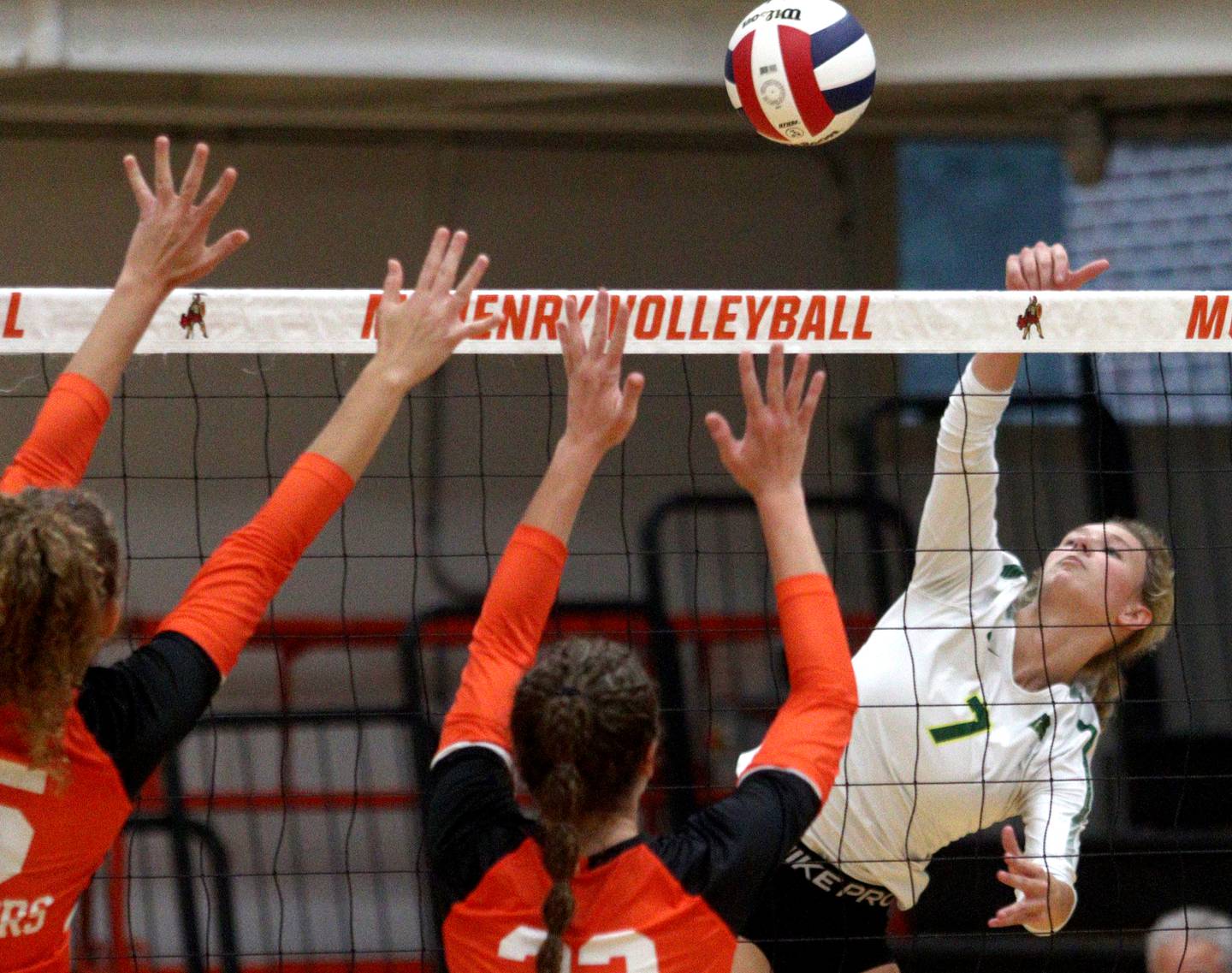 Crystal Lake South’s Gabby Wire sends the ball over the net in varsity volleyball at McHenry Tuesday night.