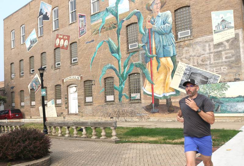 Shawn Beck, from DeKalb, runs Wednesday, June 28, 2023, past Memorial Park on Lincoln Highway in DeKalb. Beck recently completed his goal of running every street in DeKalb County.