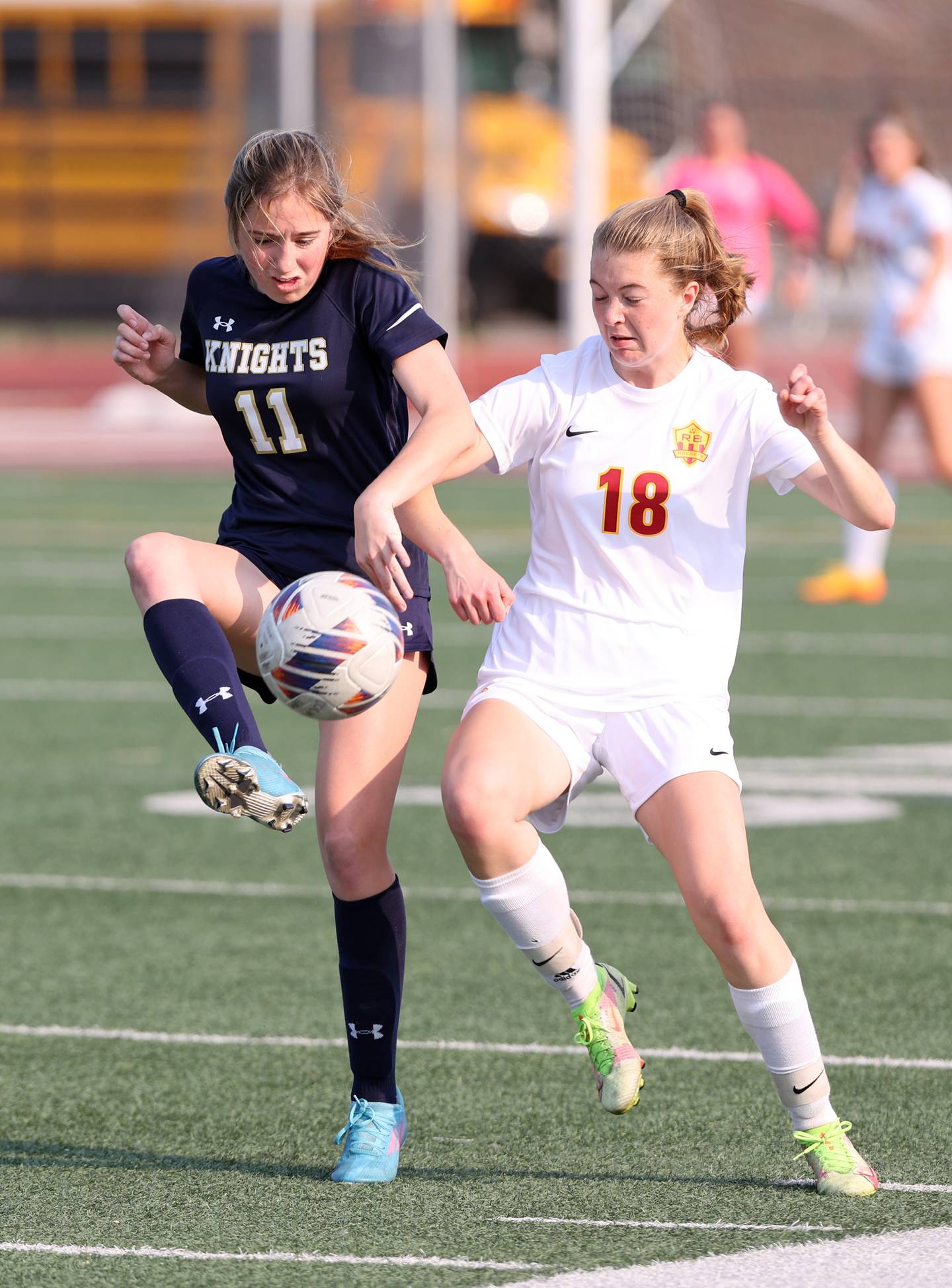 Richmond-Burton's Rachel Mendlik (18) and IC Catholic's Alysa Lawton (11) fight for the ball during the IHSA Class 1A girls soccer super-sectional match between Richmond-Burton and IC Catholic at Concordia University in River Forest on Tuesday, May 23, 2023.