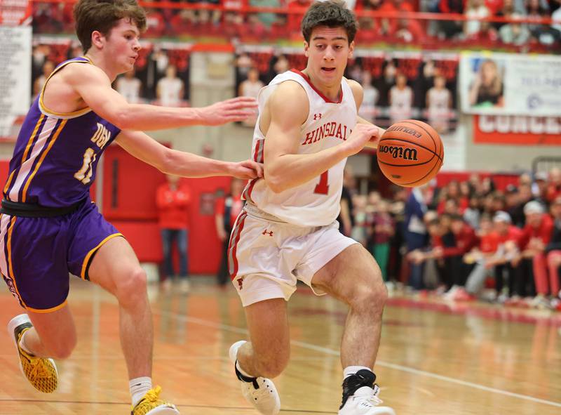 Hinsdale Central's Evan Phillips (1) brings the ball up court during the boys 4A varsity sectional final game between Hinsdale Central and Downers Grove North high schools in Hinsdale on Friday, March 3, 2023.