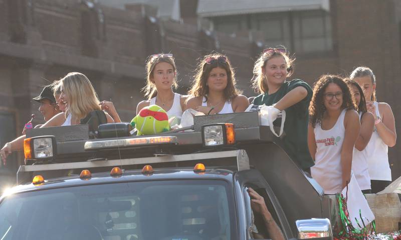 Members of the L-P girls tennis team ride on a float during the L-P homecoming parade on Thursday, Oct. 2, 2025 downtown Peru.