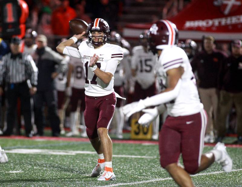 Brother Rice quarterback Ryan Hartz looks to pass the ball during a Class 7A round 1 playoff game in Batavia on Friday, Oct. 27, 2023.