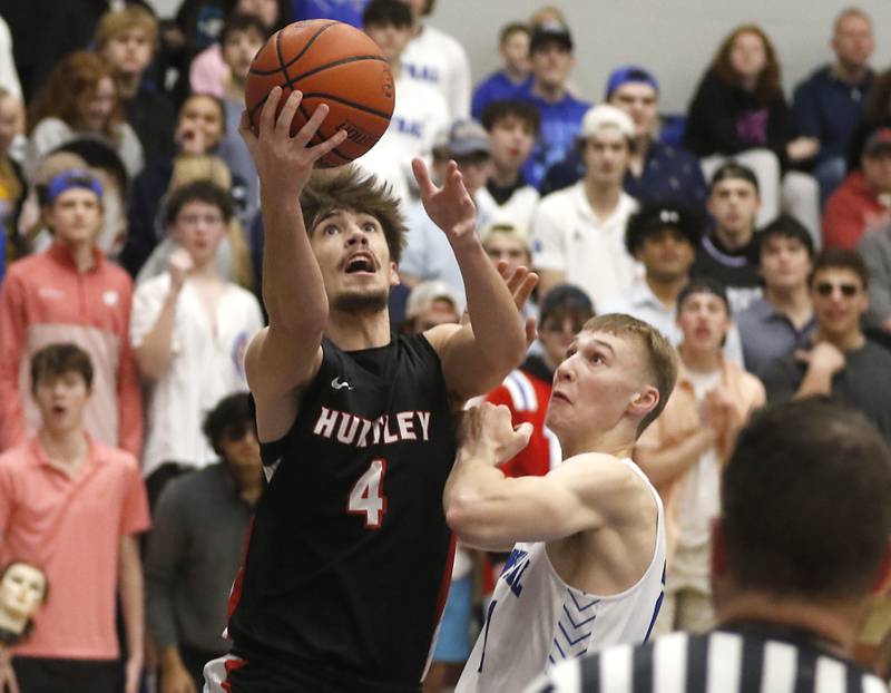 Huntley’s Ian Ravagnie drives to the basket against Burlington Central's Andrew Scharnowski during a Fox Valley Conference boys basketball game Wednesday, Jan. 11, 2023, at Central High School in Burlington.