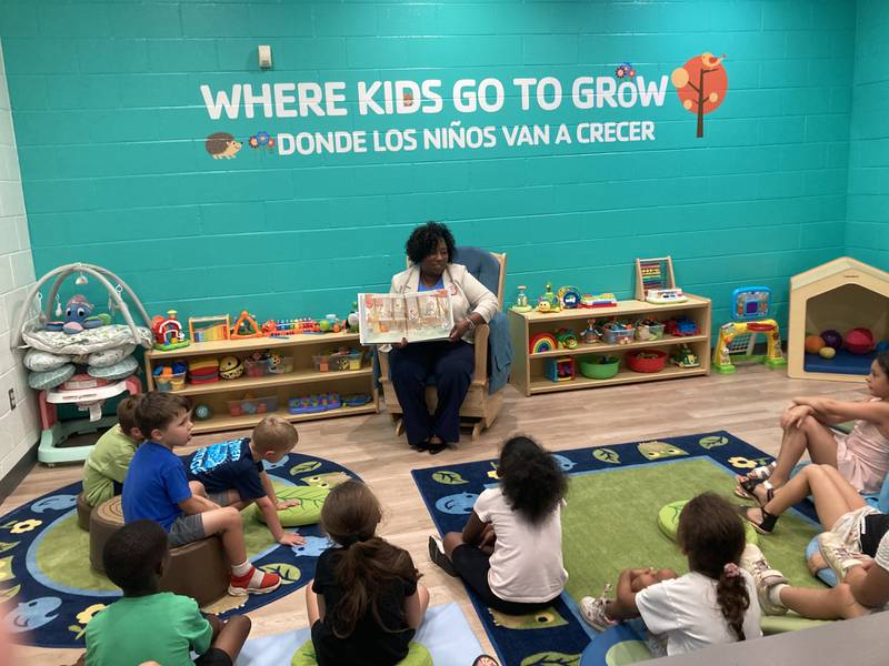 Will County Circuit Court Judge Colette Safford reads "Coat of Many Colors" by Dolly Parton to children after the launch event for Imagination Library in Will County. 
Monday, July 28, 2025.