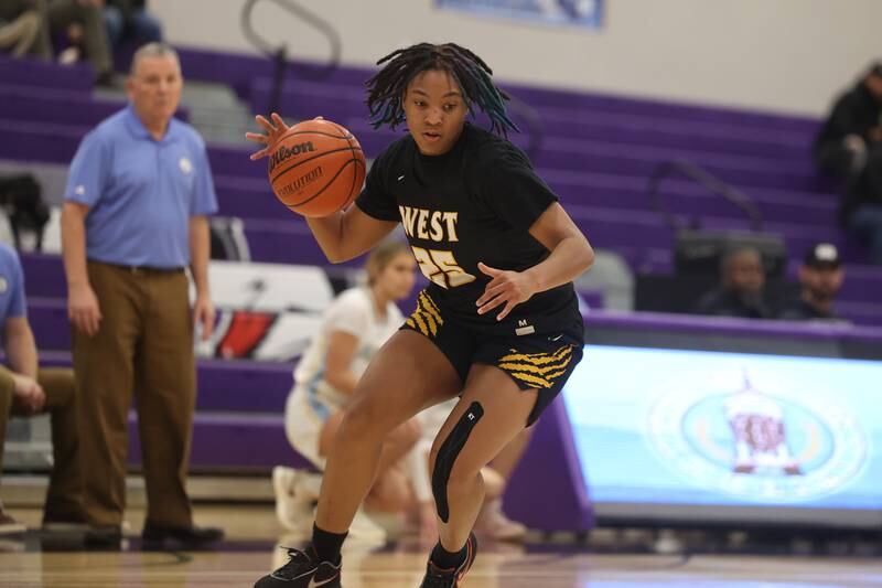 Joliet West’s Mariah Shelton makes a move to the basket against Joliet Catholic in the 2023 WJOL Girls Basketball Tournament on Friday, Nov. 17, 2023, in Joliet