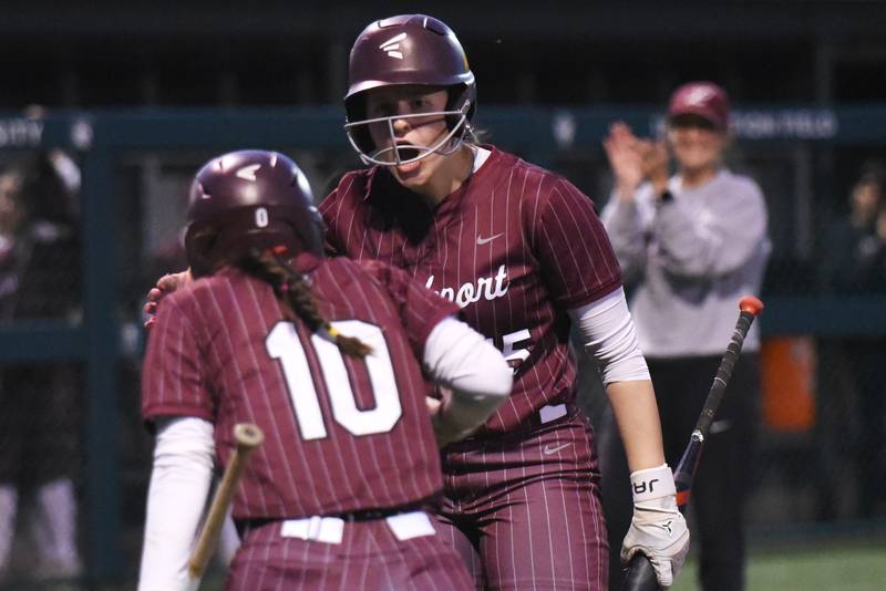 Lockport's Liliana Janeczko congratulates teammate Addison Way (10) while head coach Marissa Chovanec applauds in the background after Way's run in the Class 4A Illinois Wesleyan Supersectional against Bradley-Bourbonnais Monday, June 9, 2025.