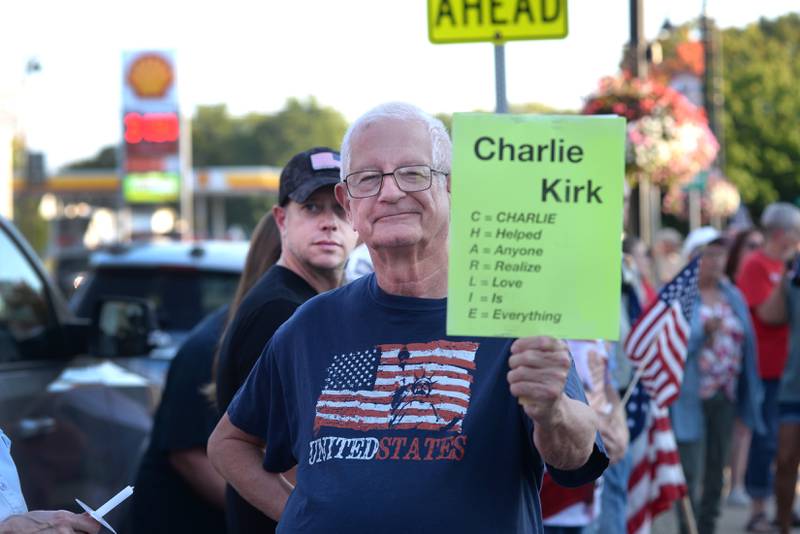 Jerry Stauffer of Mt. Morris was one an estimated 350 people who attended a candlelight vigil for Charlie Kirk in front of the historic Ogle County Courthouse in downtown Oregon on Sunday, Sept. 14, 2025.