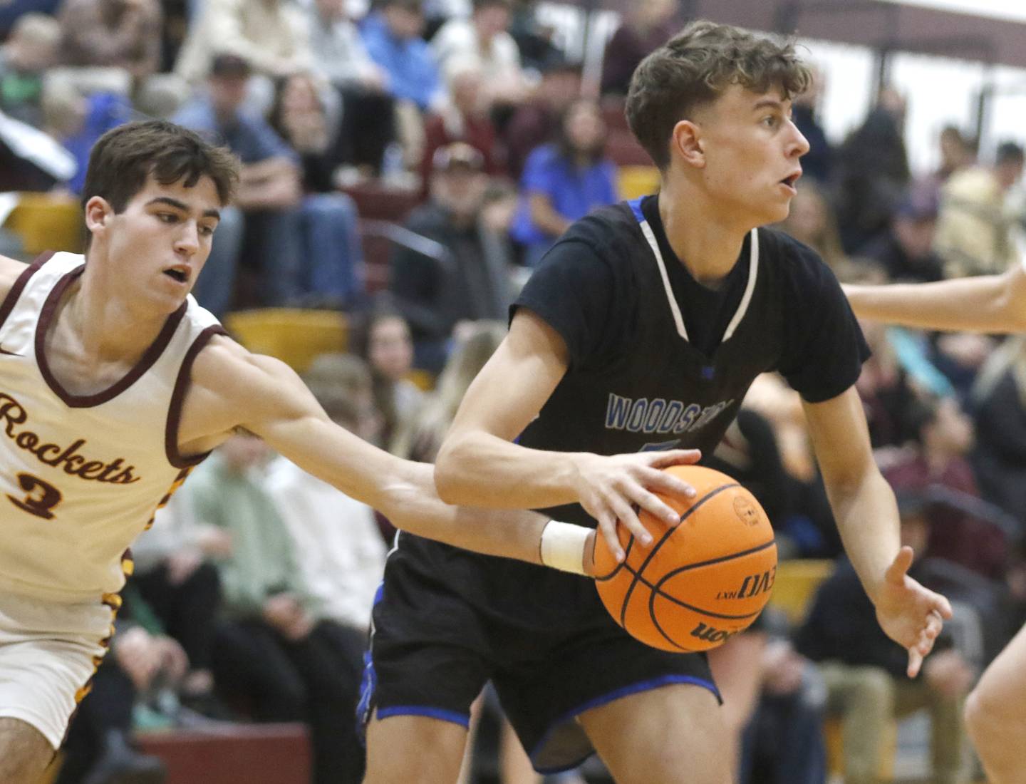 Richmond-Burton's Dane Gardner tries to steal the ball from Woodstock's Max Beard during a Kishwaukee River Conference boys basketball game on Friay Jan. 9  2026, at Richmond-Burton High School, in Richmond.