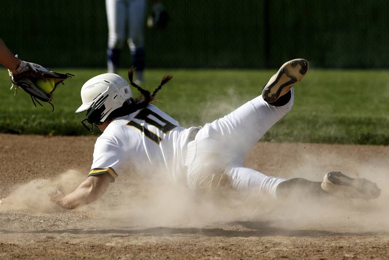 Crystal Lake South's Alexis Pupillo slides around the tag attempt of Burlington Central's Rylie Duval during a Fox Valley Conference softball game Monday, May 16, 2022, between Crystal Lake South and Burlington Central at Crystal Lake South High School.