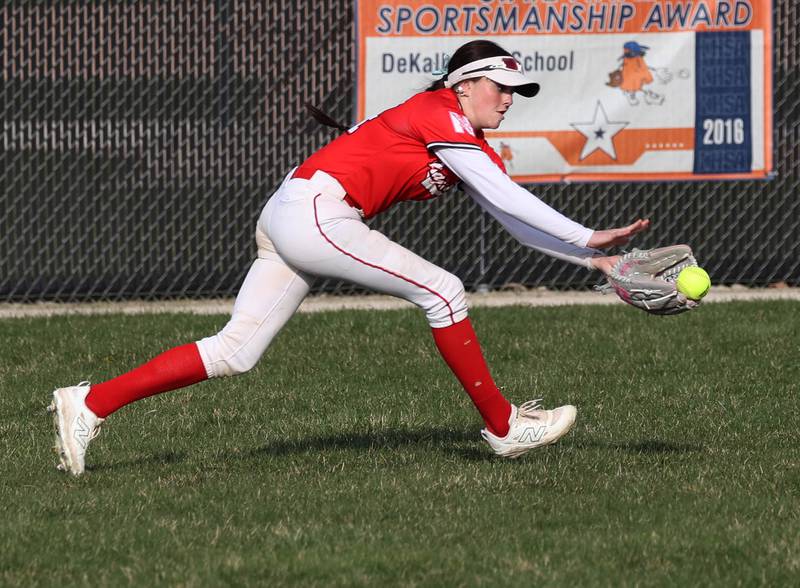 Naperville Central's Cali Lenz makes a running catch Wednesday, April 16, 2025, during their game at DeKalb High School.