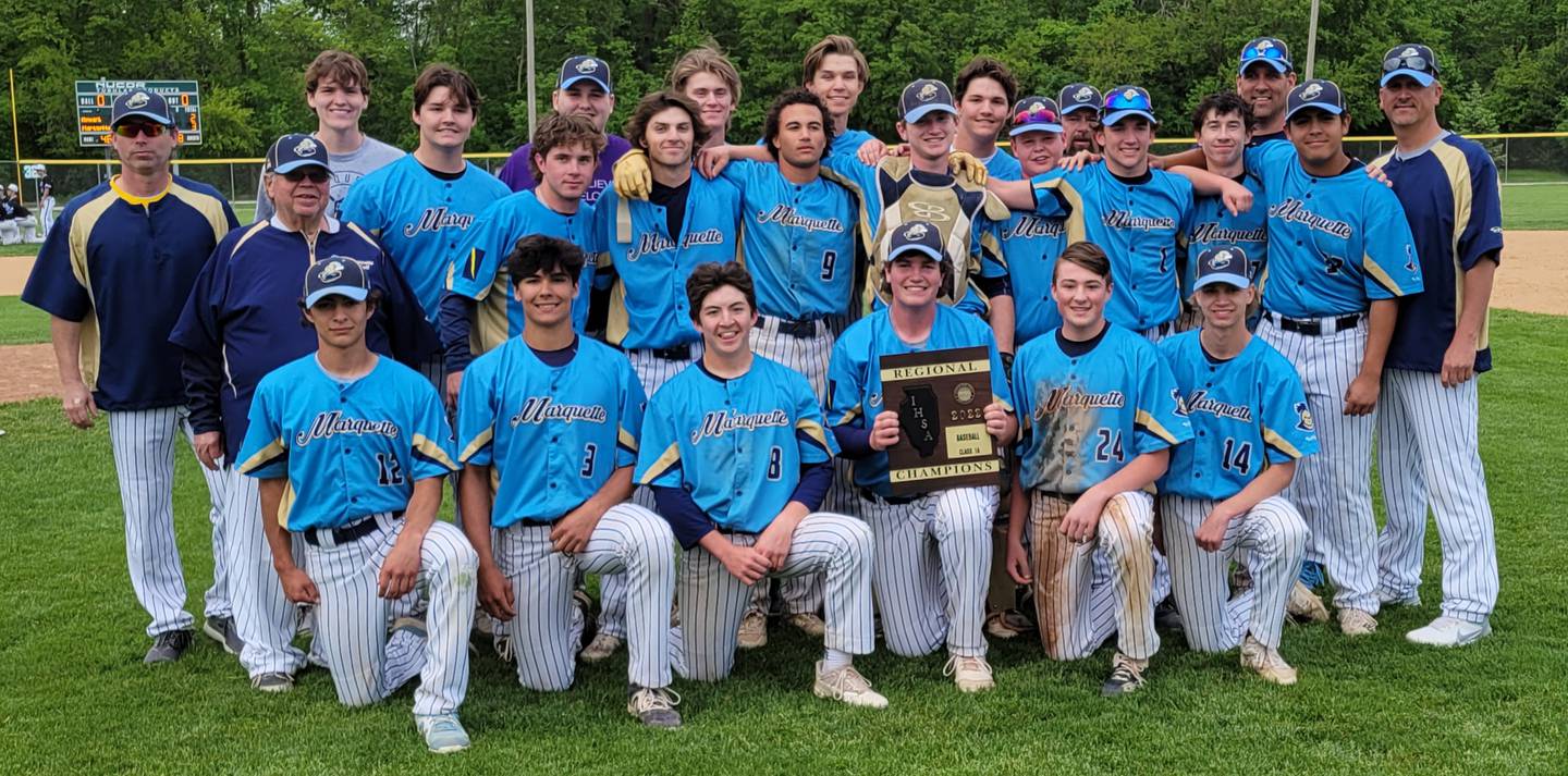 The Marquette Academy baseball team poses with its Class 1A regional championship plaque after topping Newark 3-2 on Monday afternoon in a game suspended by rain on Saturday at Masinelli Field in Ottawa.