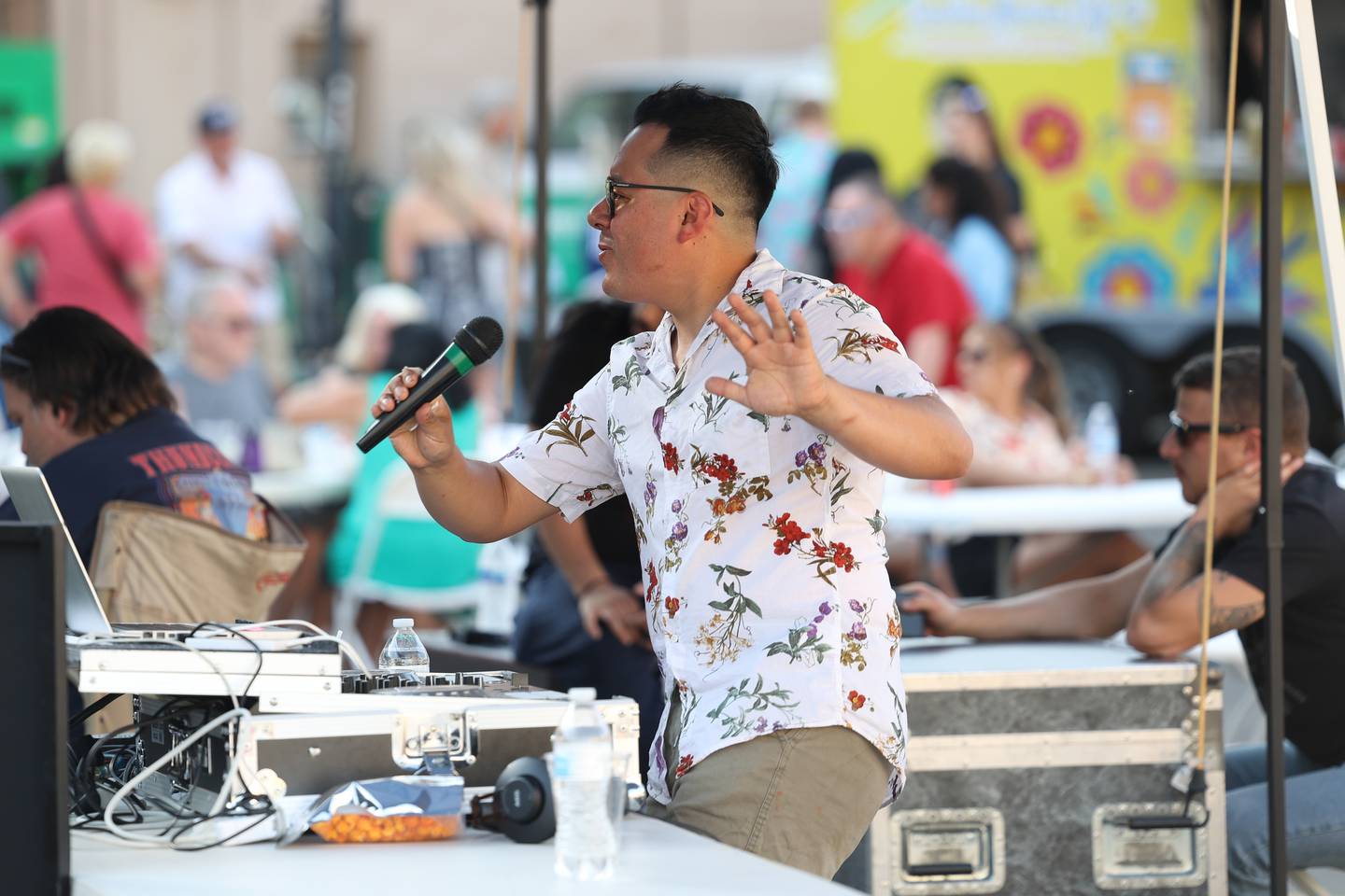 DJ Leon provides the music at Salsa Fest on Friday, June 9, 2023 in Downtown Joliet.